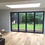 Extension in Winsley built of Farmington natural stone with engineered oak flooring, underfloor heating, aluminium windows and an EPDM flat roof.