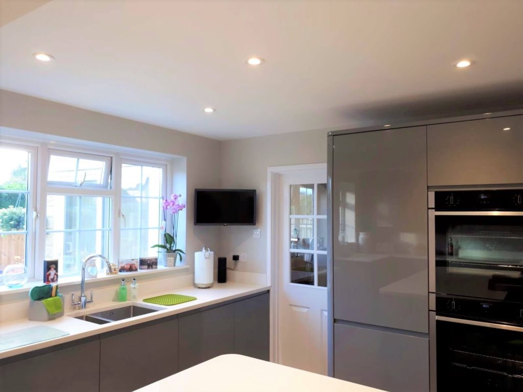 Howdens Clerkenwell Gloss kitchen in slate grey with white quartz worktops